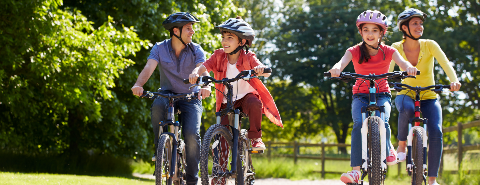 A family riding their bikes through the Tohoqua community